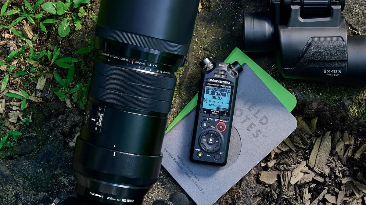 OM System LS-P5 recorder with field notes and camera gear