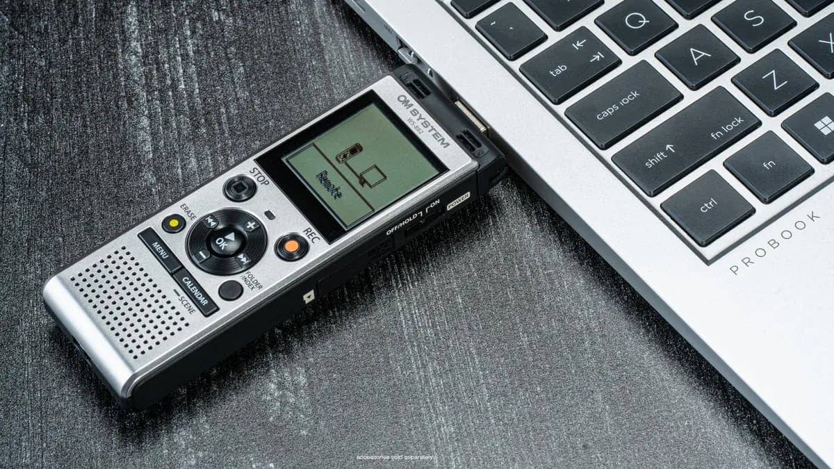 OM System WS-882 voice recorder plugged directly into a laptop USB port