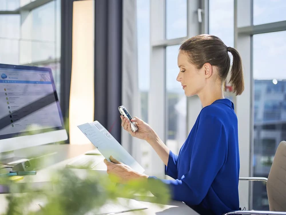 Lawyer in office dictating with a Philips PocketMemo DPM8000