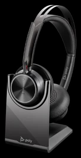 Poly Voyager Focus 2 USB headset on desktop charging stand