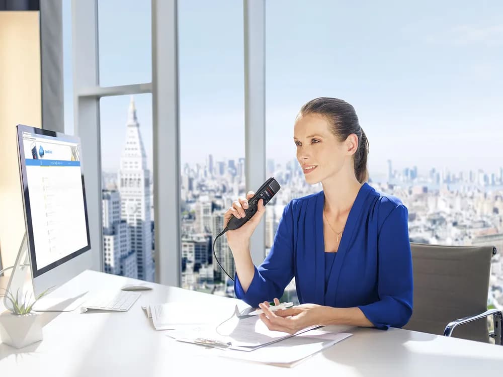 Lawyer dictating with a Philips SpeechMike Premium Touch for legal speech recognition